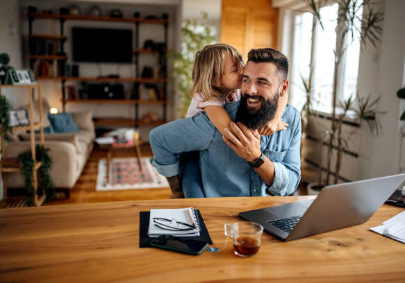 Working father bonding with his daughter