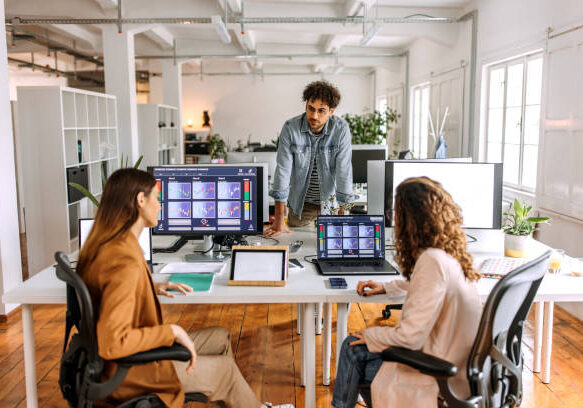 Colleagues analysing  cryptocurrency at the office